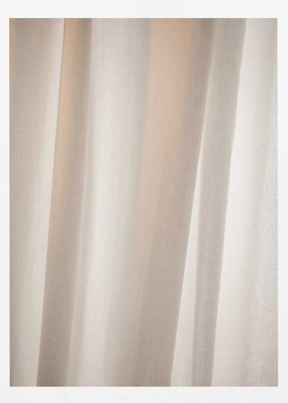 Abstract photo of light beige fabric with soft, flowing folds creating gentle shadows.