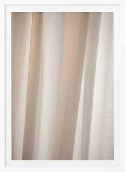 Abstract photo of light beige fabric with soft, flowing folds creating gentle shadows.