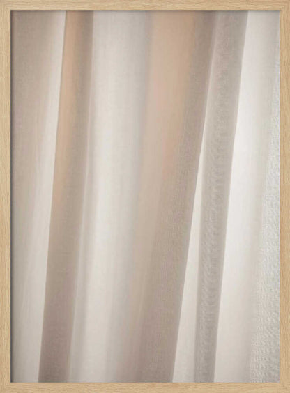 Abstract photo of light beige fabric with soft, flowing folds creating gentle shadows.