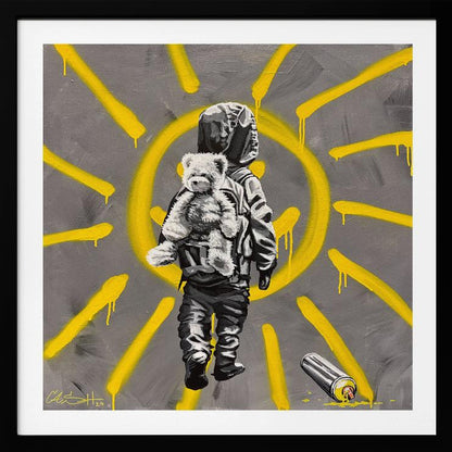 A framed street art-style painting with a grey background. A large, yellow, spray-painted sun with dripping rays dominates the scene. In the foreground, a small child in a dark hoodie and pants is depicted from behind in black and white, carrying a fluffy teddy bear on their back. A discarded spray paint can lies on the ground in the bottom right corner. Poster
