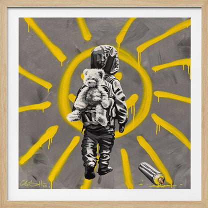 A framed street art-style painting with a grey background. A large, yellow, spray-painted sun with dripping rays dominates the scene. In the foreground, a small child in a dark hoodie and pants is depicted from behind in black and white, carrying a fluffy teddy bear on their back. A discarded spray paint can lies on the ground in the bottom right corner. Poster