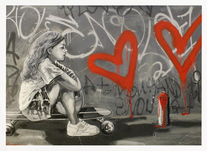 A monochrome street art painting of a young girl with long hair sitting thoughtfully on a skateboard. Behind her, a grey wall is covered in graffiti tags and two large, bright red hearts are spray-painted with drips running down. A red and white spray paint can sits on the ground next to her. Artwork