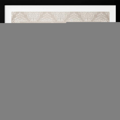 A framed artwork depicting two small, ornate elephants facing each other in the center, their trunks touching. They are decorated with colorful floral patterns and stand against a large, intricate white mandala on a light beige background. The piece is bordered with a white pattern and set in a light wood frame. Wall Art