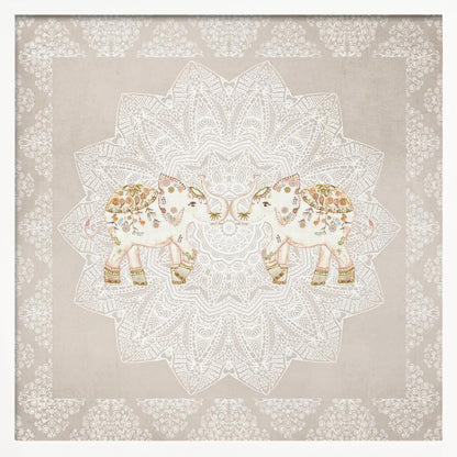 A framed artwork depicting two small, ornate elephants facing each other in the center, their trunks touching. They are decorated with colorful floral patterns and stand against a large, intricate white mandala on a light beige background. The piece is bordered with a white pattern and set in a light wood frame. Wall Art
