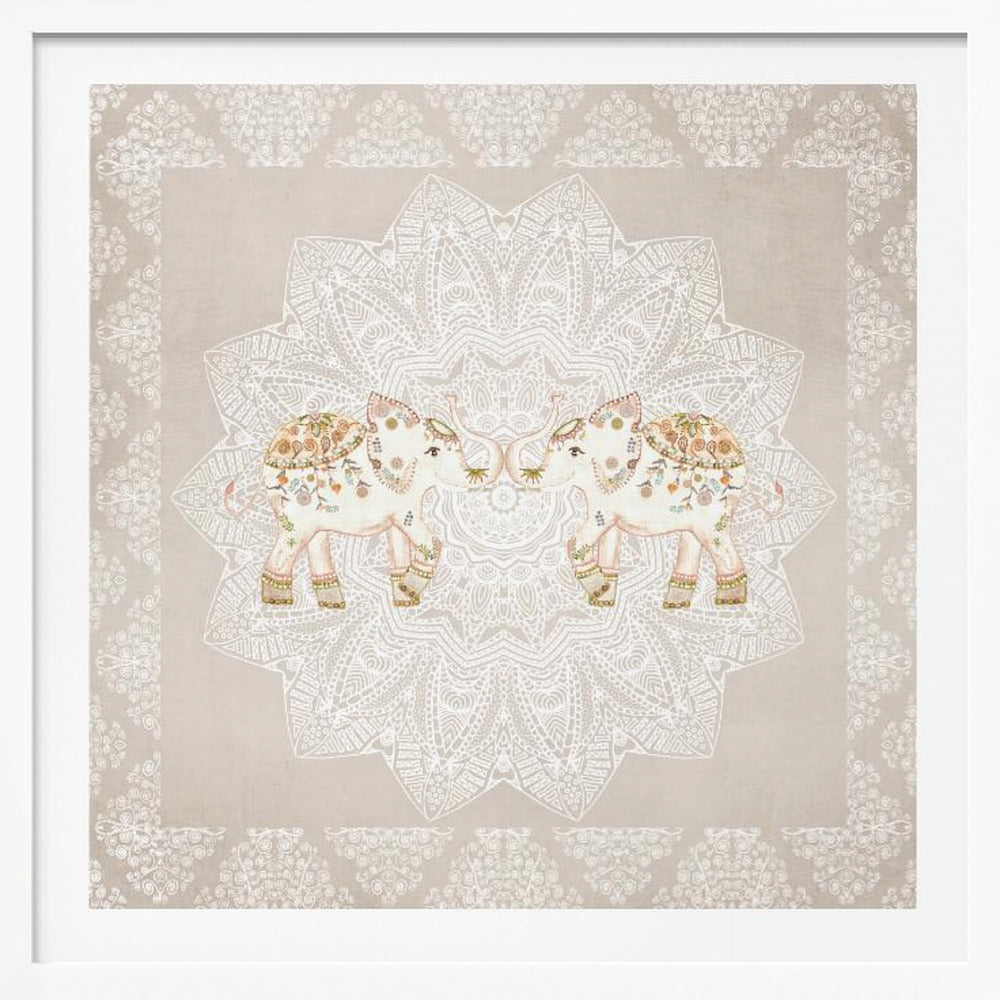 A framed artwork depicting two small, ornate elephants facing each other in the center, their trunks touching. They are decorated with colorful floral patterns and stand against a large, intricate white mandala on a light beige background. The piece is bordered with a white pattern and set in a light wood frame. Wall Art