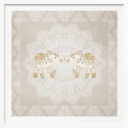 A framed artwork depicting two small, ornate elephants facing each other in the center, their trunks touching. They are decorated with colorful floral patterns and stand against a large, intricate white mandala on a light beige background. The piece is bordered with a white pattern and set in a light wood frame. Wall Art