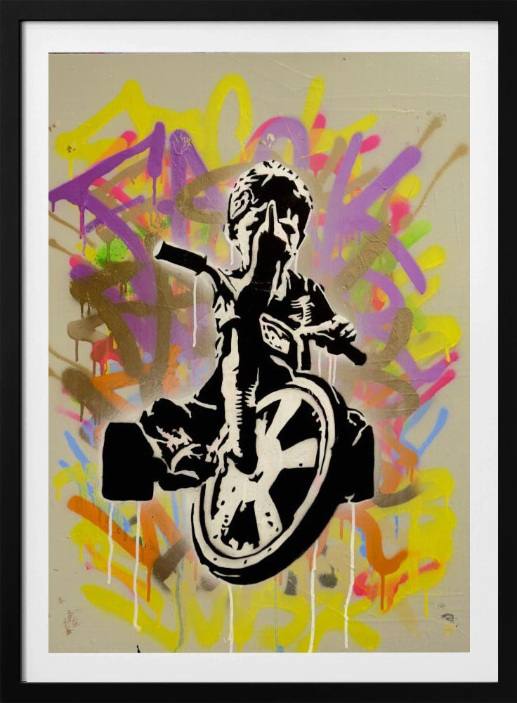 A framed street art piece featuring a black and white stencil of a rebellious child on a tricycle giving the middle finger, set against a vibrant, multi-colored graffiti background with paint drips. Artwork