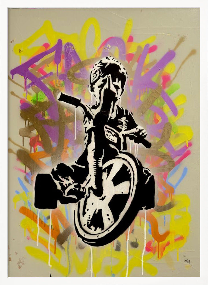 A framed street art piece featuring a black and white stencil of a rebellious child on a tricycle giving the middle finger, set against a vibrant, multi-colored graffiti background with paint drips. Artwork
