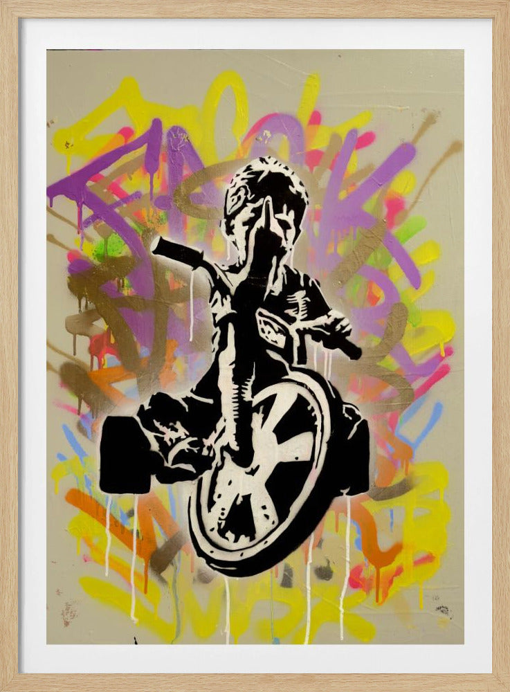 A framed street art piece featuring a black and white stencil of a rebellious child on a tricycle giving the middle finger, set against a vibrant, multi-colored graffiti background with paint drips. Artwork