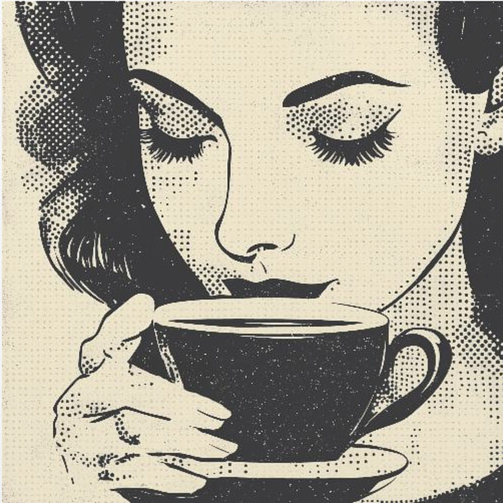 A pop art style illustration of a woman with dark hair and long eyelashes, her eyes closed as she holds a black coffee cup and saucer. The image uses a halftone dot pattern common in retro comics, set against a cream-colored background and framed in light wood. Print