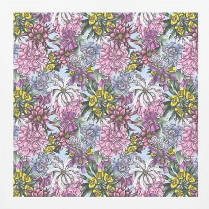 A framed artwork displaying a dense, repeating floral pattern with detailed illustrations of pink, purple, blue, white, and yellow flowers on a light blue background, encased in a simple light wood frame. Decor