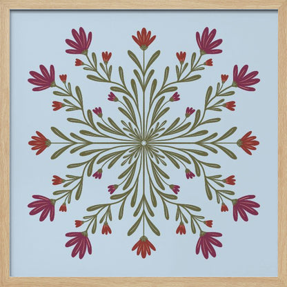 A framed art print with a symmetrical floral mandala on a light blue background. Olive green stems and leaves radiate from the center, blooming with magenta and red flowers. The artwork is enclosed in a light wood frame. Wall Art