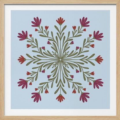 A framed art print with a symmetrical floral mandala on a light blue background. Olive green stems and leaves radiate from the center, blooming with magenta and red flowers. The artwork is enclosed in a light wood frame. Wall Art