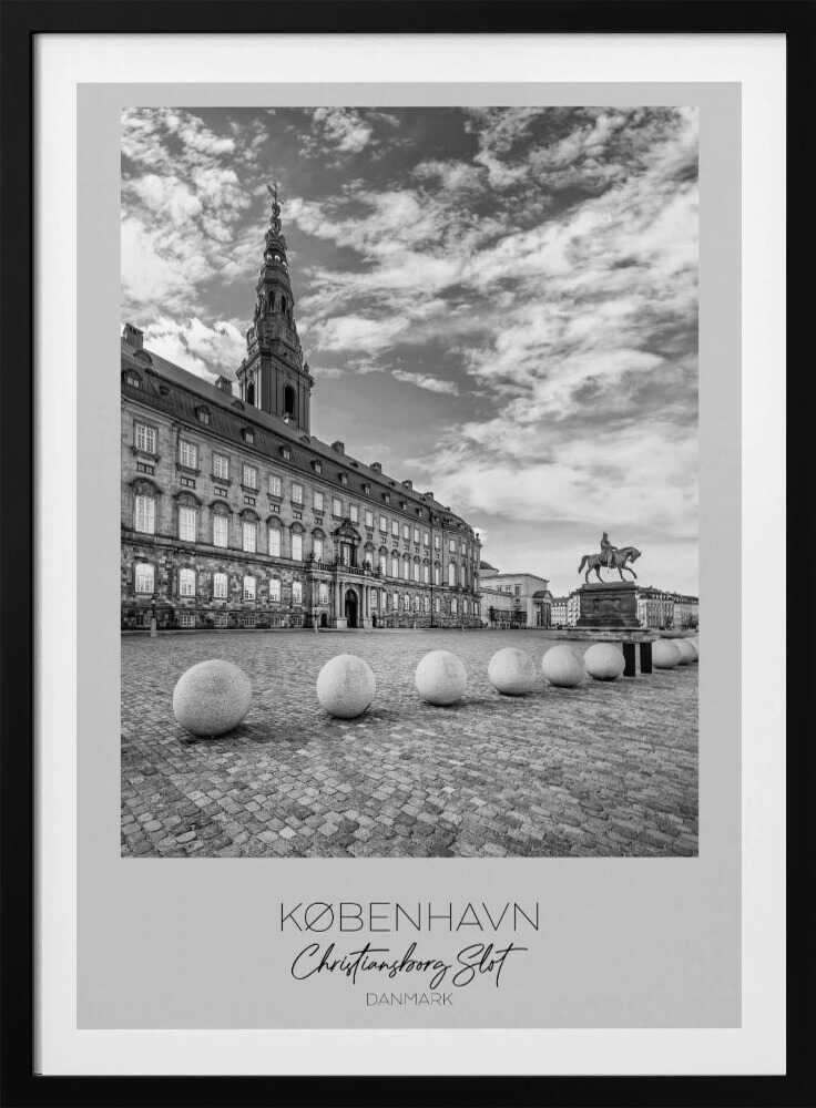 A black and white travel poster of Christiansborg Palace in Copenhagen, Denmark. The image shows the grand building and its tower against a dramatic cloudy sky, with a cobblestone square, stone bollards, and an equestrian statue in the foreground. Text at the bottom identifies the location. Decor