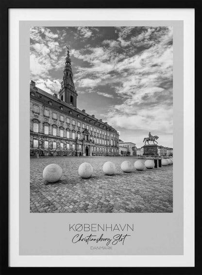 A black and white travel poster of Christiansborg Palace in Copenhagen, Denmark. The image shows the grand building and its tower against a dramatic cloudy sky, with a cobblestone square, stone bollards, and an equestrian statue in the foreground. Text at the bottom identifies the location. Decor