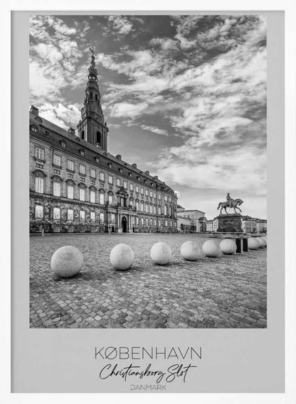 A black and white travel poster of Christiansborg Palace in Copenhagen, Denmark. The image shows the grand building and its tower against a dramatic cloudy sky, with a cobblestone square, stone bollards, and an equestrian statue in the foreground. Text at the bottom identifies the location. Decor
