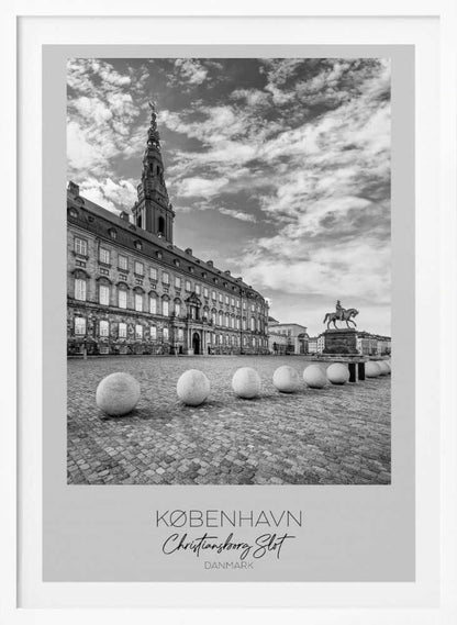 A black and white travel poster of Christiansborg Palace in Copenhagen, Denmark. The image shows the grand building and its tower against a dramatic cloudy sky, with a cobblestone square, stone bollards, and an equestrian statue in the foreground. Text at the bottom identifies the location. Decor