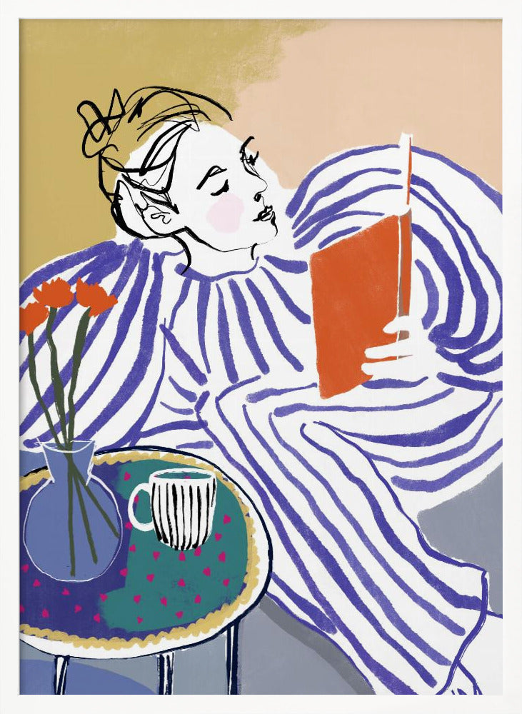 A stylized, framed illustration of a person with dark hair in a messy bun, wearing a blue and white striped top, reclining comfortably while engrossed in an orange book. Beside them is a small table with a blue vase holding three orange flowers and a black and white striped mug. The background is a soft beige color. Print