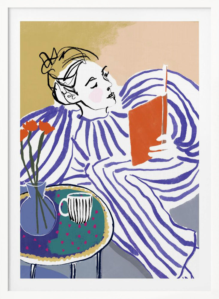 A stylized, framed illustration of a person with dark hair in a messy bun, wearing a blue and white striped top, reclining comfortably while engrossed in an orange book. Beside them is a small table with a blue vase holding three orange flowers and a black and white striped mug. The background is a soft beige color. Print