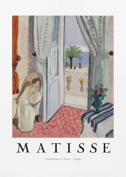 A framed art print of Henri Matisse's painting 'Intérieur à Nice - 1939'. The painting depicts a woman in a white robe sitting in a sunlit room with an open door leading to a balcony overlooking the sea and a palm tree. The poster has a white border with the artist's name and the title below the artwork. Artwork