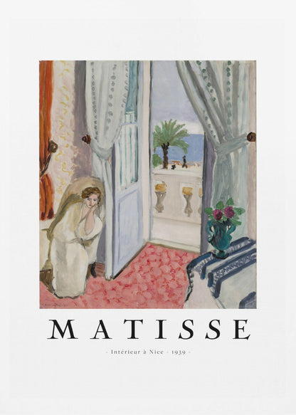 A framed art print of Henri Matisse's painting 'Intérieur à Nice - 1939'. The painting depicts a woman in a white robe sitting in a sunlit room with an open door leading to a balcony overlooking the sea and a palm tree. The poster has a white border with the artist's name and the title below the artwork. Artwork