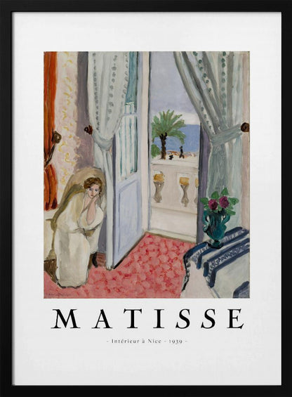 A framed art print of Henri Matisse's painting 'Intérieur à Nice - 1939'. The painting depicts a woman in a white robe sitting in a sunlit room with an open door leading to a balcony overlooking the sea and a palm tree. The poster has a white border with the artist's name and the title below the artwork. Artwork