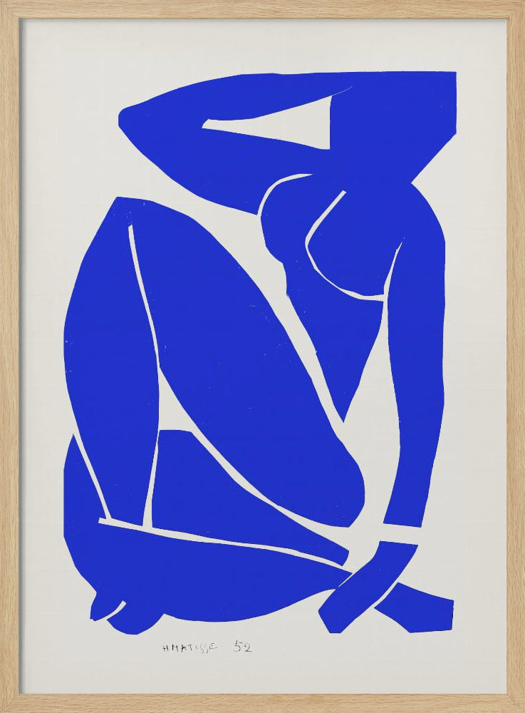 A framed print of Henri Matisse's 'Blue Nude II', featuring a bold, royal blue paper cutout of a seated female nude against an off-white background. The figure is stylized and abstract, with limbs folded and one arm behind her head. Print