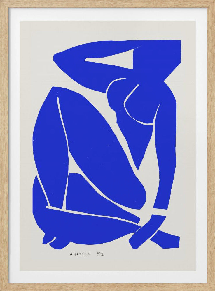 A framed print of Henri Matisse's 'Blue Nude II', featuring a bold, royal blue paper cutout of a seated female nude against an off-white background. The figure is stylized and abstract, with limbs folded and one arm behind her head. Print