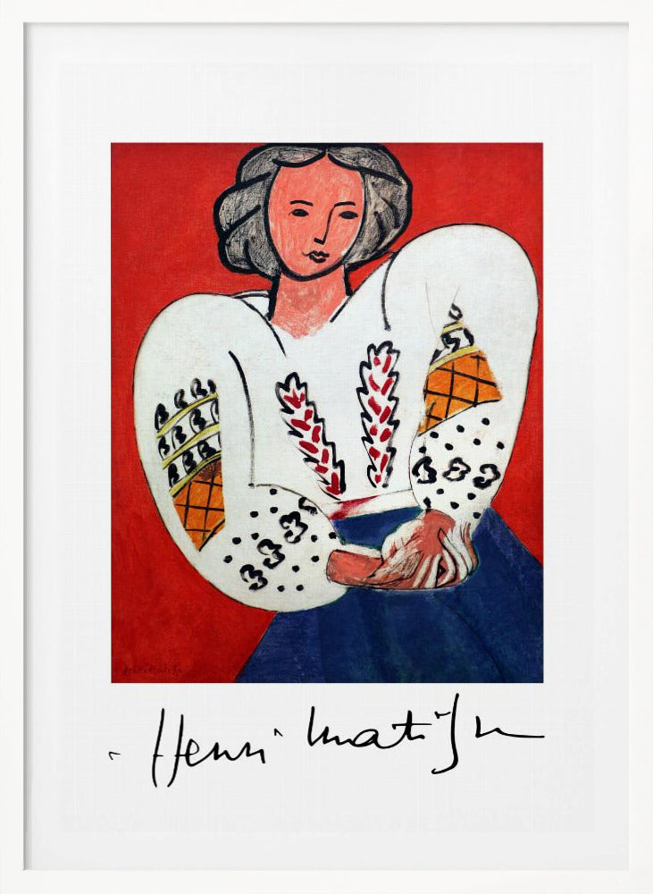 A framed art print of Henri Matisse's 'La Blouse Roumaine' (The Romanian Blouse). The painting depicts a woman with dark, styled hair against a vibrant solid red background. She is wearing a voluminous white blouse with puffy, intricately decorated sleeves and a dark blue skirt. Her hands are clasped in front of her. Below the image is the signature 'Henri Matisse'. Wall Art