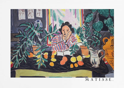 A framed print of the painting 'Woman with a Book' by Henri Matisse. The artwork features a woman in a red, white, and blue striped shirt sitting at a dark table filled with potted green plants and colorful fruit. She rests her head on her hand, looking out from the painting in a Fauvist style with bold colors and expressive brushwork. Poster