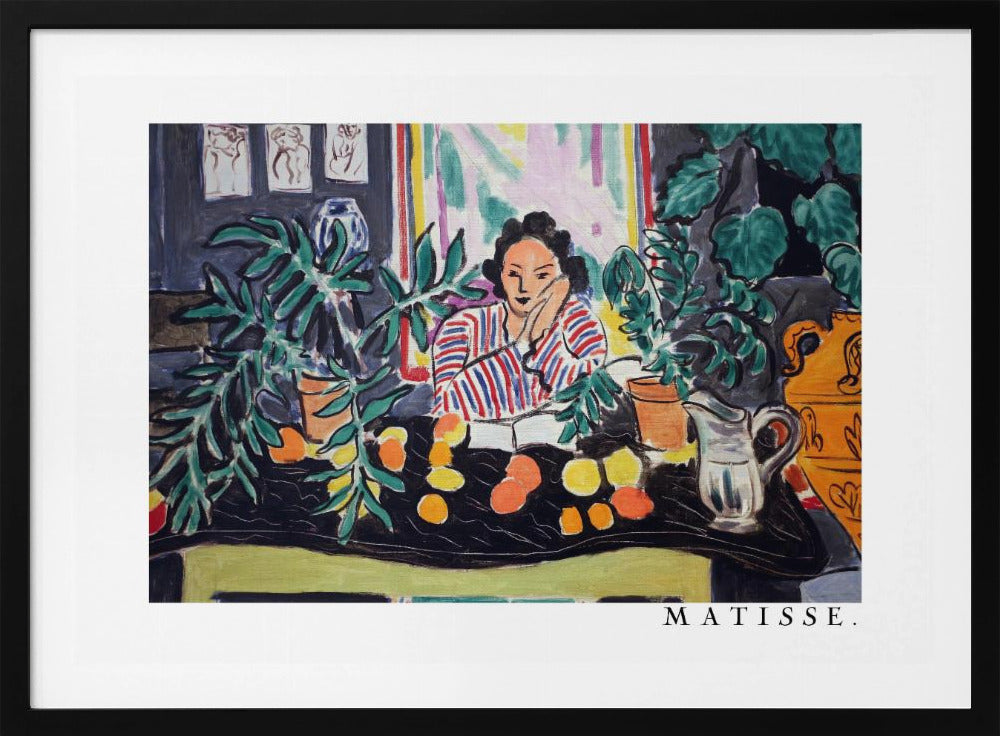 A framed print of the painting 'Woman with a Book' by Henri Matisse. The artwork features a woman in a red, white, and blue striped shirt sitting at a dark table filled with potted green plants and colorful fruit. She rests her head on her hand, looking out from the painting in a Fauvist style with bold colors and expressive brushwork. Poster