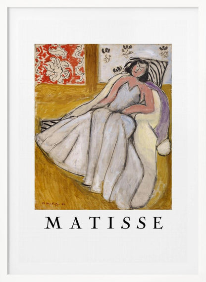 An art print poster of a Henri Matisse painting. The image features a woman with dark hair wearing a long, light-colored dress, reclining in a golden-yellow armchair. The background includes a red and white floral pattern and other decorative elements. The word 'MATISSE' is printed in large black letters below the artwork, all enclosed in a black frame. Decor