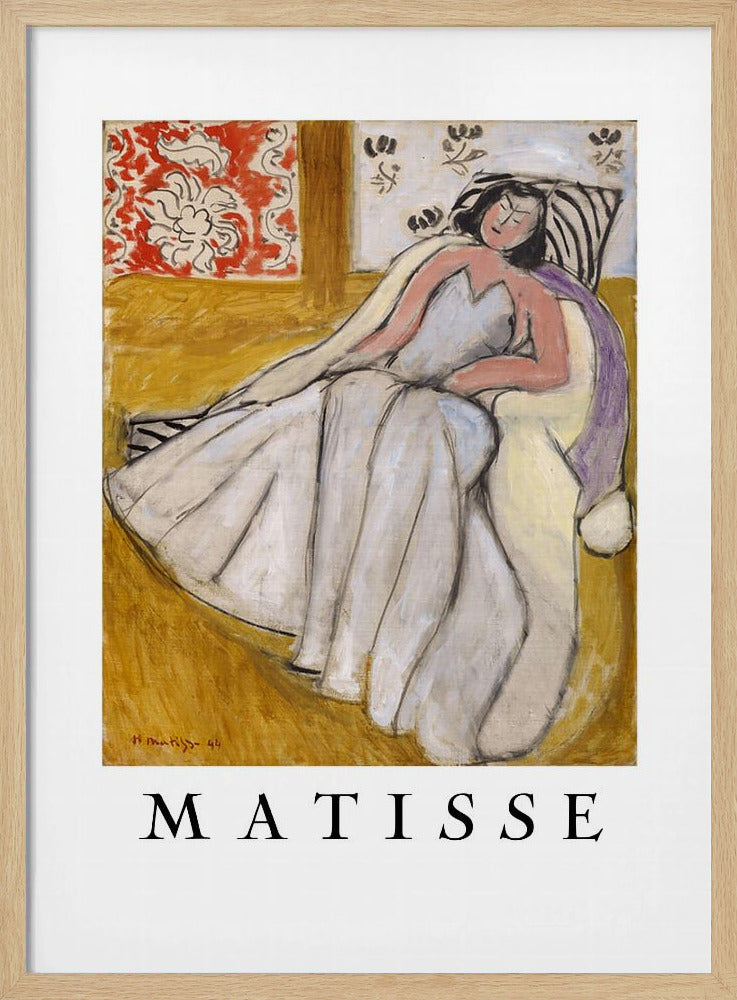 An art print poster of a Henri Matisse painting. The image features a woman with dark hair wearing a long, light-colored dress, reclining in a golden-yellow armchair. The background includes a red and white floral pattern and other decorative elements. The word 'MATISSE' is printed in large black letters below the artwork, all enclosed in a black frame. Decor