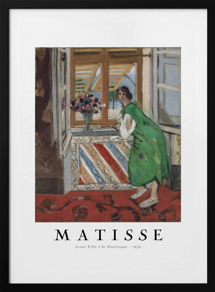A framed art print of Henri Matisse's painting 'Jeune Fille à la Mauresque - 1939'. The painting shows a woman in a vibrant green dress standing in a room and looking out of an open window with shutters. A red patterned rug covers the floor, and a vase of flowers sits on the windowsill. Poster