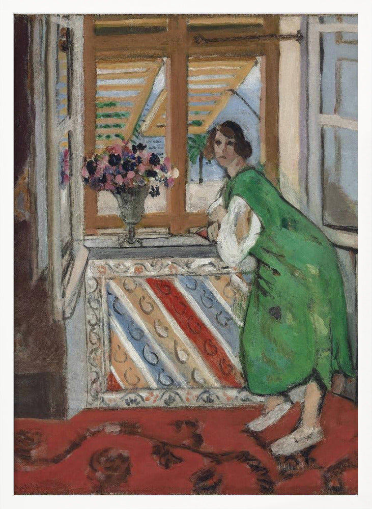 A painting by Henri Matisse depicting a woman in a loose green dress leaning on a windowsill and looking towards the viewer. Outside the open window with tan shutters, a sunny scene with a palm tree is visible. A vase of flowers sits on the sill above a colorful striped panel, and a red patterned rug covers the floor. Print