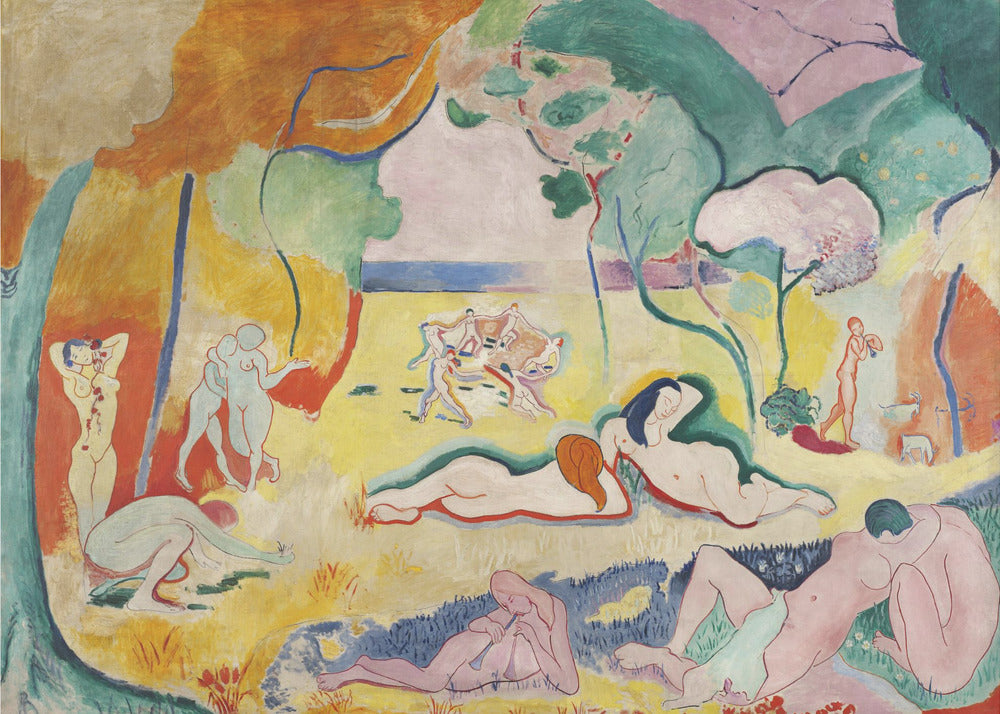 A framed print of Henri Matisse's Fauvist painting, 'Le bonheur de vivre' (The Joy of Life). It shows a vibrant, colorful landscape with numerous nude figures relaxing, dancing, and playing music. The scene uses unnaturalistic colors like yellow earth, orange and green trees, and a pink sky to evoke a sense of idyllic joy. Decor