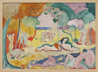 A framed print of Henri Matisse's Fauvist painting, 'Le bonheur de vivre' (The Joy of Life). It shows a vibrant, colorful landscape with numerous nude figures relaxing, dancing, and playing music. The scene uses unnaturalistic colors like yellow earth, orange and green trees, and a pink sky to evoke a sense of idyllic joy. Decor