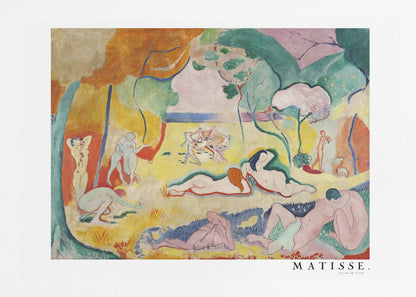 A framed art print of Henri Matisse's famous Fauvist painting, 'Le Bonheur de Vivre' (The Joy of Life). The colorful, idyllic landscape is filled with nude figures lounging, dancing, and playing music under vibrant yellow, orange, and green trees against a pink sky. Wall Art