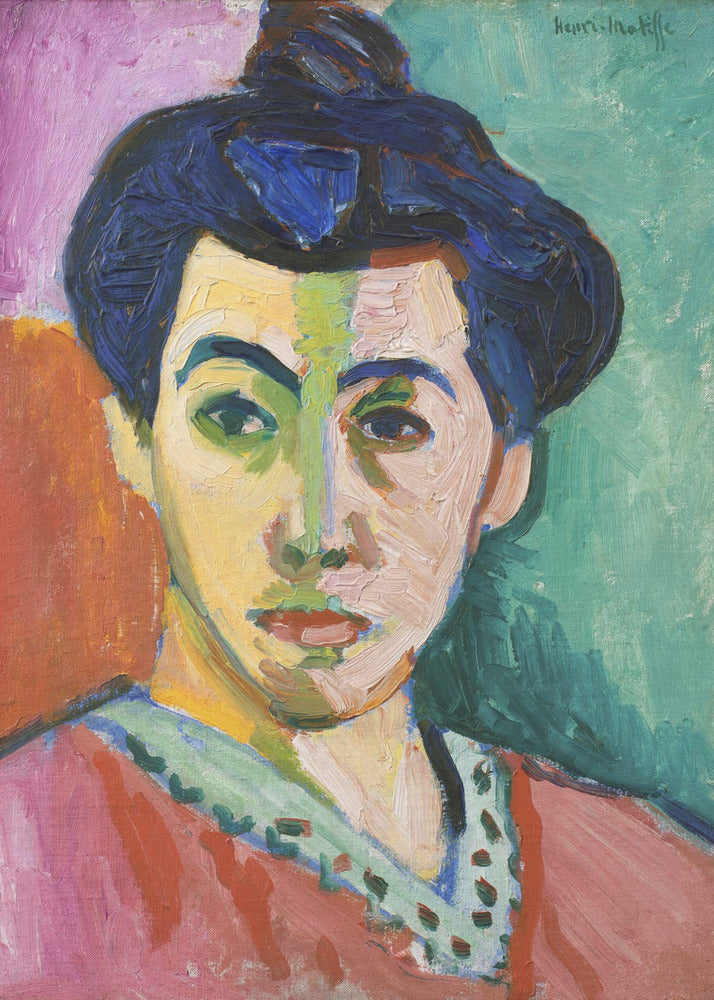 A Fauvist portrait painting by Henri Matisse, 'The Green Stripe,' featuring a woman with dark hair in an updo. Her face is strikingly rendered with unrealistic colors, bisected by a prominent green stripe. The background is composed of bold, flat planes of pink, orange, and teal. Print