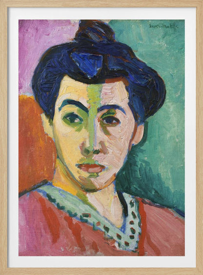 A Fauvist portrait painting by Henri Matisse, 'The Green Stripe,' featuring a woman with dark hair in an updo. Her face is strikingly rendered with unrealistic colors, bisected by a prominent green stripe. The background is composed of bold, flat planes of pink, orange, and teal. Print