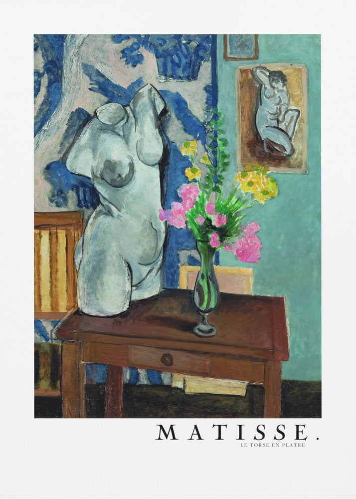 A framed art print of Henri Matisse's painting 'Le Torse en Plâtre'. The still life features a white plaster female torso sculpture next to a dark brown wooden table with a vase of pink and yellow flowers. The background consists of a blue and white patterned tapestry and a teal wall with a small framed nude drawing. Print