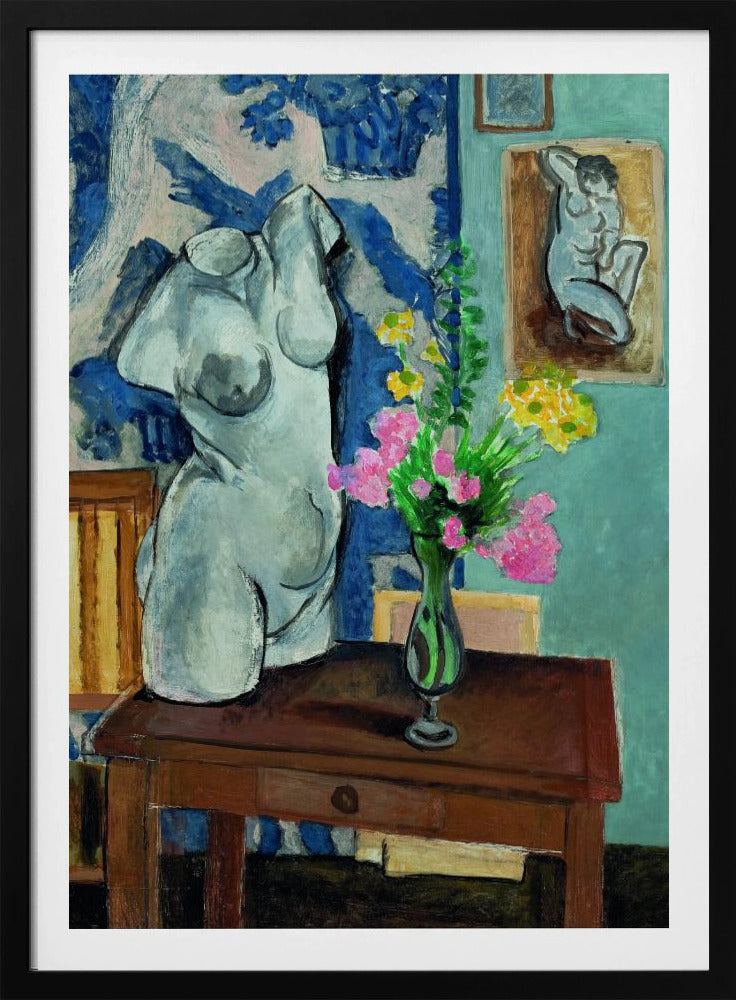 A colorful still life painting by Henri Matisse depicting a white plaster torso of a woman on a dark brown table next to a vase of bright pink and yellow flowers. The background features a blue and white patterned fabric and a light blue wall with a small framed nude drawing. Decor