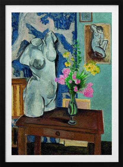 A colorful still life painting by Henri Matisse depicting a white plaster torso of a woman on a dark brown table next to a vase of bright pink and yellow flowers. The background features a blue and white patterned fabric and a light blue wall with a small framed nude drawing. Decor