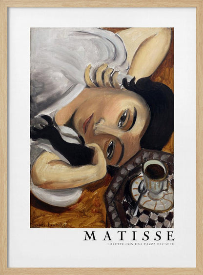A framed art print of Henri Matisse's painting, 'Lorette con una tazza di caffè' (Lorette with a Cup of Coffee). The portrait features a woman with dark hair lying down, gazing directly at the viewer, with a cup of coffee on a checkered saucer beside her. The artist's name and the title are printed below the image. Decor