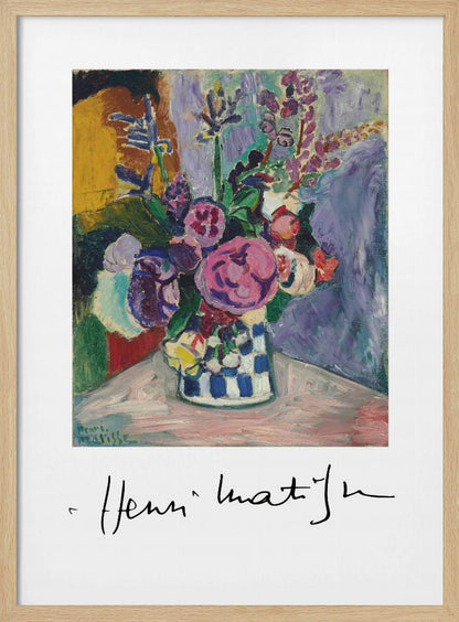 A framed art print of a vibrant Henri Matisse painting. The still life features a bouquet of colorful pink, purple, and white flowers in a blue and white checkered vase, set against a multi-toned background. The artist's signature is displayed below the painting on the white mat. Print