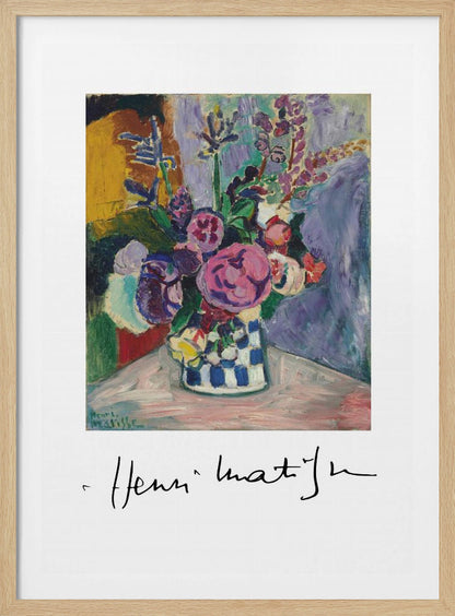 A framed art print of a vibrant Henri Matisse painting. The still life features a bouquet of colorful pink, purple, and white flowers in a blue and white checkered vase, set against a multi-toned background. The artist's signature is displayed below the painting on the white mat. Print