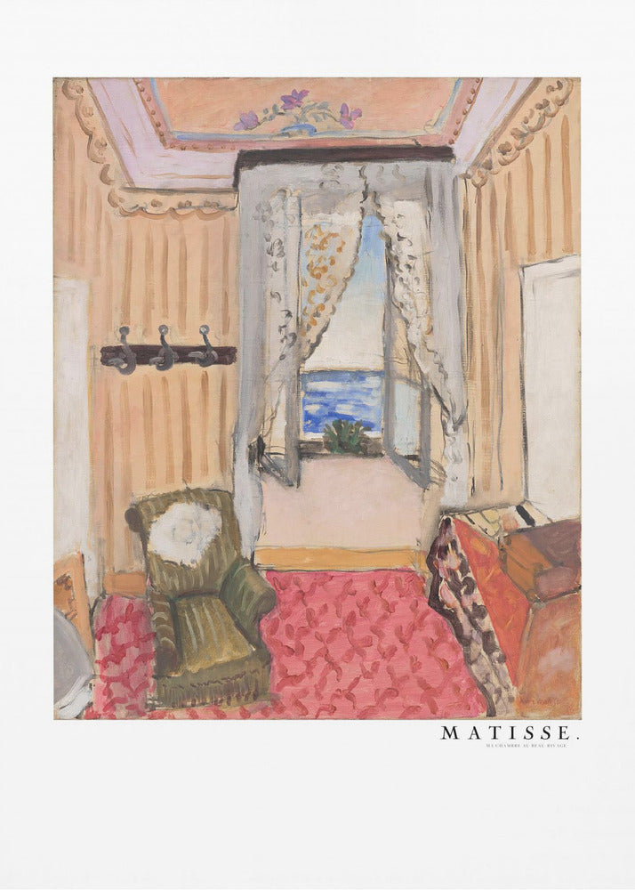 A framed print of a painting by Henri Matisse. The artwork depicts an interior room scene with peach-colored walls, a vibrant pink and red patterned rug, and an armchair. An open window with lace curtains offers a view of the blue sea. Decor
