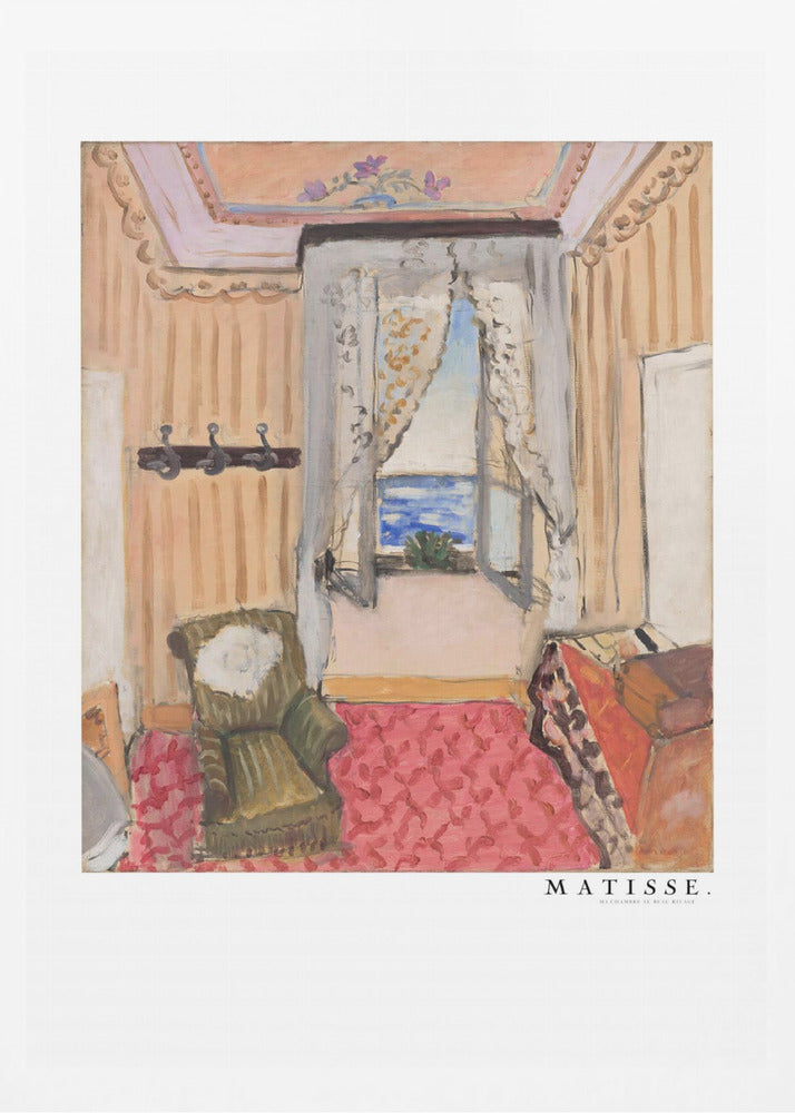 A framed print of a painting by Henri Matisse. The artwork depicts an interior room scene with peach-colored walls, a vibrant pink and red patterned rug, and an armchair. An open window with lace curtains offers a view of the blue sea. Decor