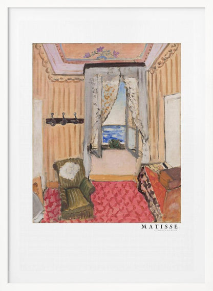 A framed print of a painting by Henri Matisse. The artwork depicts an interior room scene with peach-colored walls, a vibrant pink and red patterned rug, and an armchair. An open window with lace curtains offers a view of the blue sea. Decor