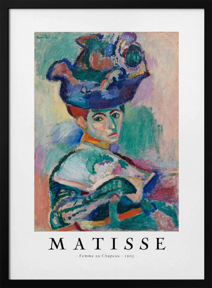 A framed art print of Henri Matisse's famous 1905 Fauvist painting, 'Femme au Chapeau' (Woman with a Hat). The portrait features a woman with an extravagantly decorated, colorful hat, painted with bold, non-naturalistic colors and expressive brushstrokes. Print